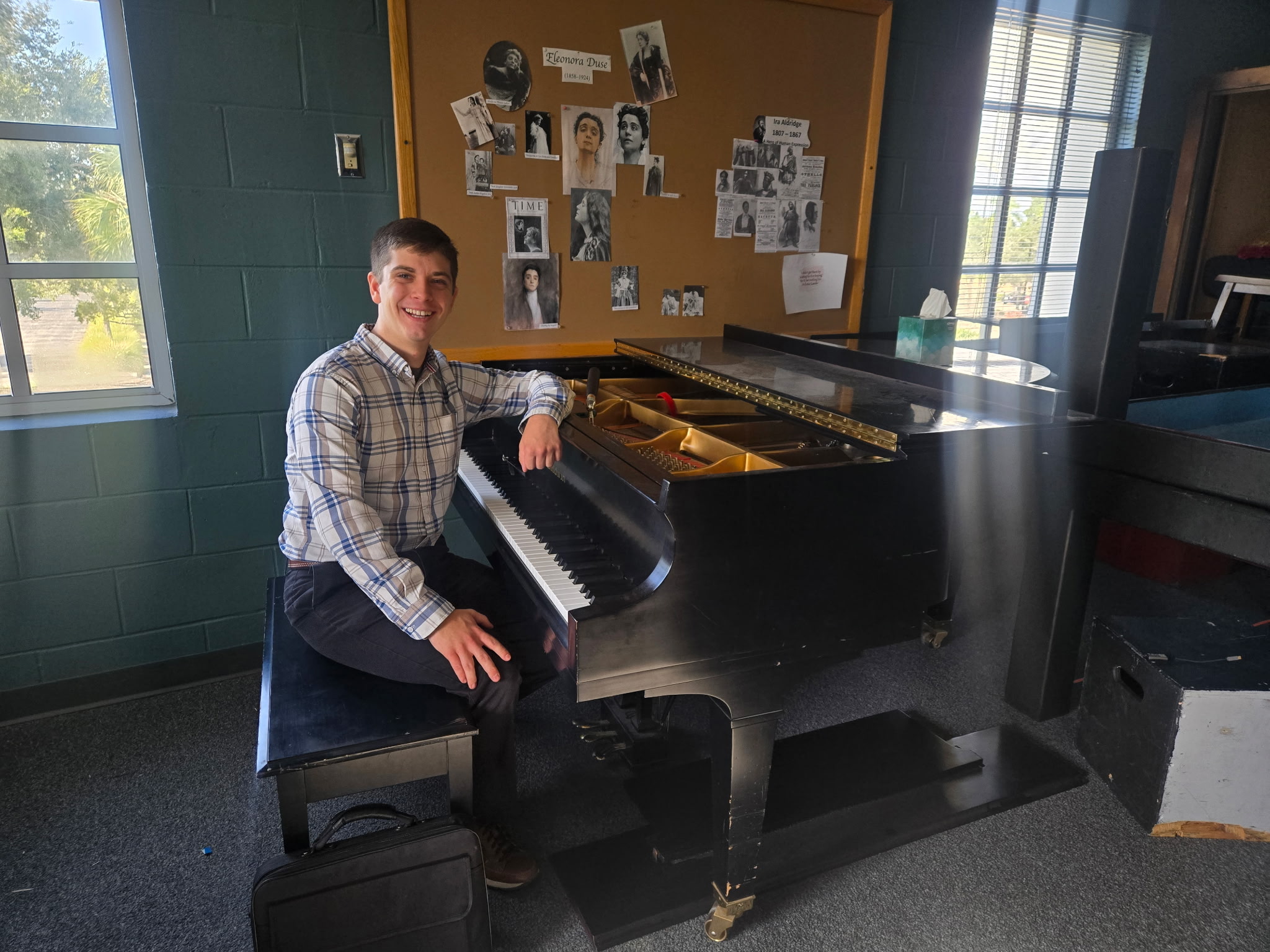 Gabriel Beggy tuning a grand piano at the Asolo